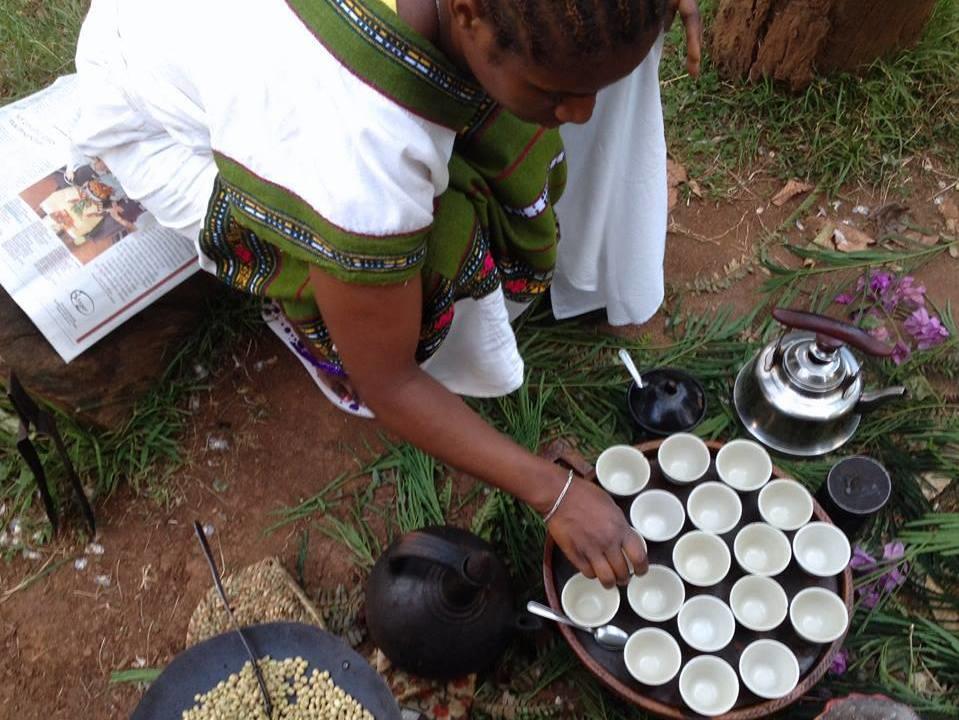 A coffee grower in Ethiopia performs a traditional coffee ceremony.