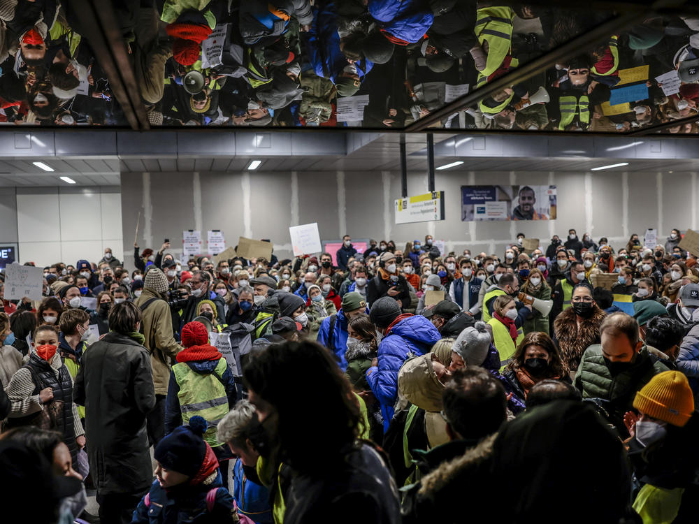 Locals offer accommodation for people fleeing war-torn Ukraine at Hauptbahnhof main railway station on Wednesday. More than a million people, mainly Ukrainian women and children as well as foreigners living in Ukraine, have fled the country as the Russian military invasion continues.