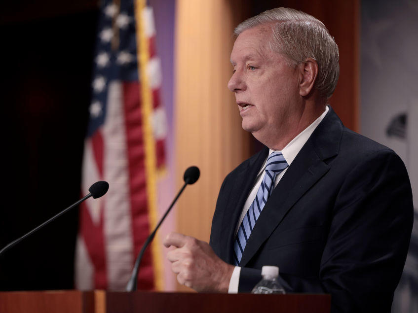 Sen. Lindsey Graham, R-S.C., speaks at a press conference in December 2021 in Washington, D.C. Comments by Graham about Russian President Vladimir Putin have drawn criticism from other lawmakers.