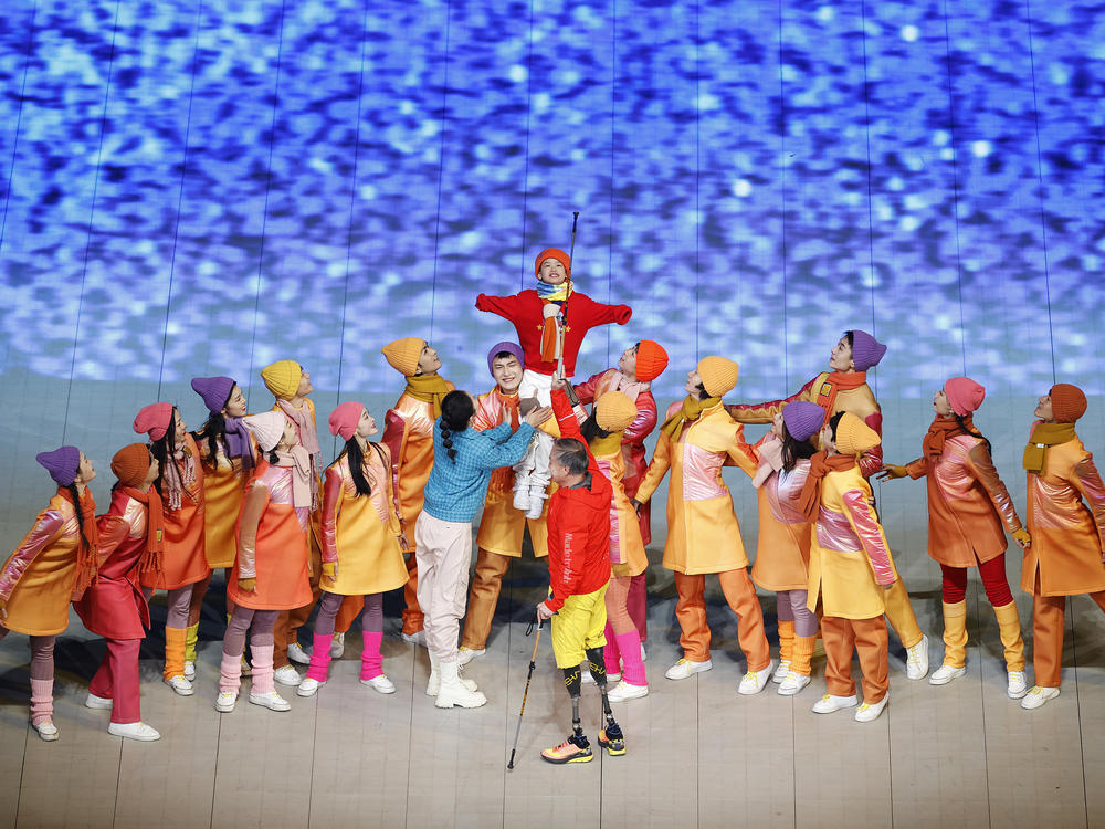 Performers dance during the storytelling component of the opening ceremony.