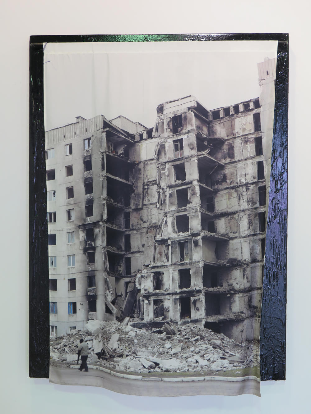 Nikita Kadan printed a photograph on silk depicting bomb damage but it comes from fighting in Ukrain's Donbas region in 2015, not the current war.