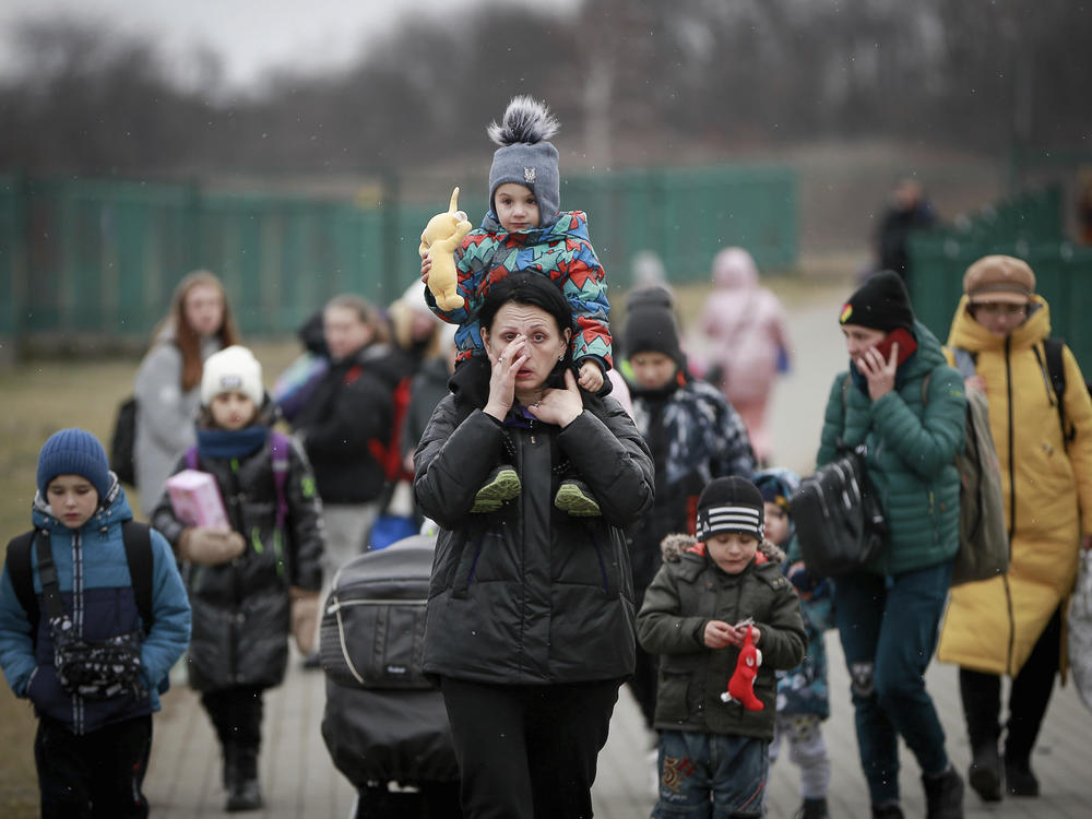 Women and children from Ukraine arrive at the border crossing in Medyka, Poland, on Saturday.