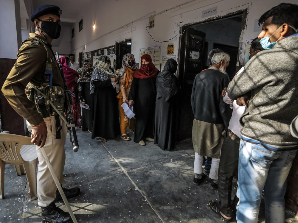 People queue to vote at a polling station in February in Lucknow. India's most populous state, Uttar Pradesh, is holding state elections as the ruling Hindu nationalist Bharatiya Janata Party of Narendra Modi looks to defend its majority.