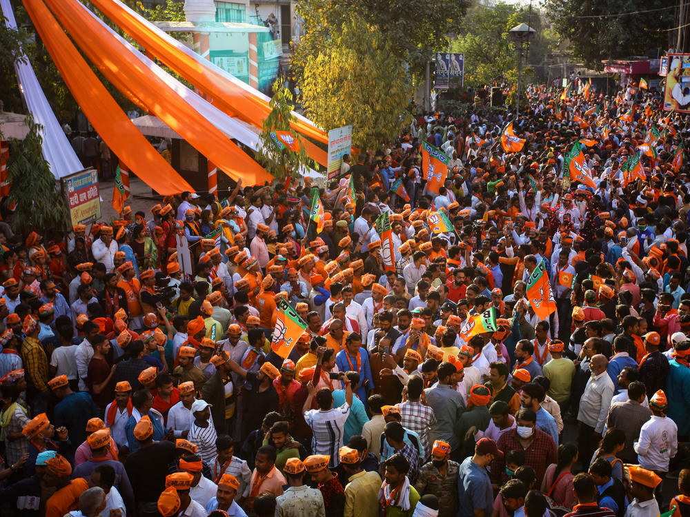 Crowds turn out to cheer India's Prime Minister Narendra Modi during a road show in support of Uttar Pradesh state elections on Friday in Varanasi, India.