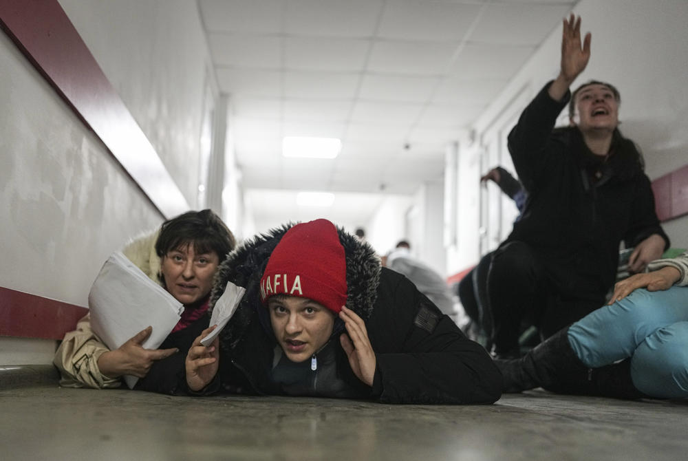 <strong>March 4:</strong> People lie on the floor of a hospital during shelling by Russian forces in Mariupol, Ukraine.