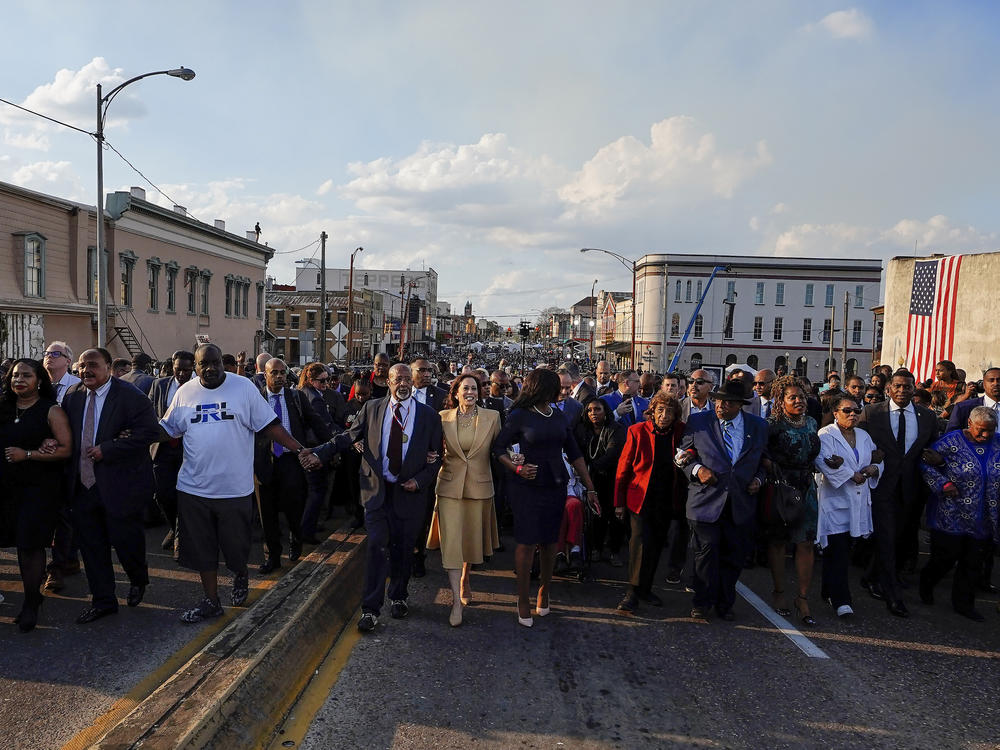 Vice President Kamala Harris marches on the Edmund Pettus Bridge after speaking in Selma, Ala., on Sunday.