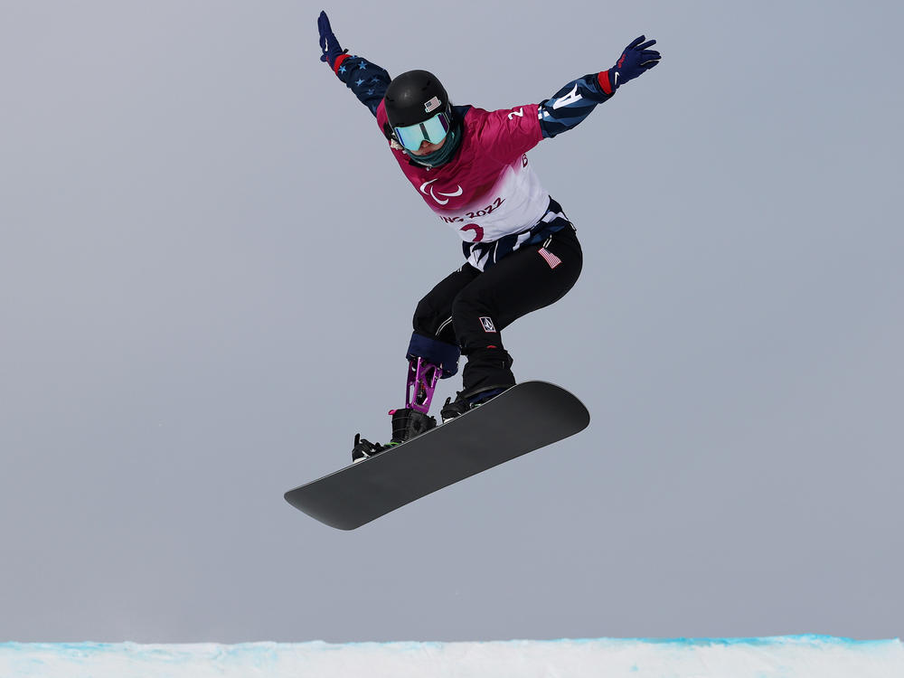 Brenna Huckaby competes during the Women's Snowboard Cross SB-LL2 Qualification during day two of the Beijing 2022 Winter Paralympics on Sunday.
