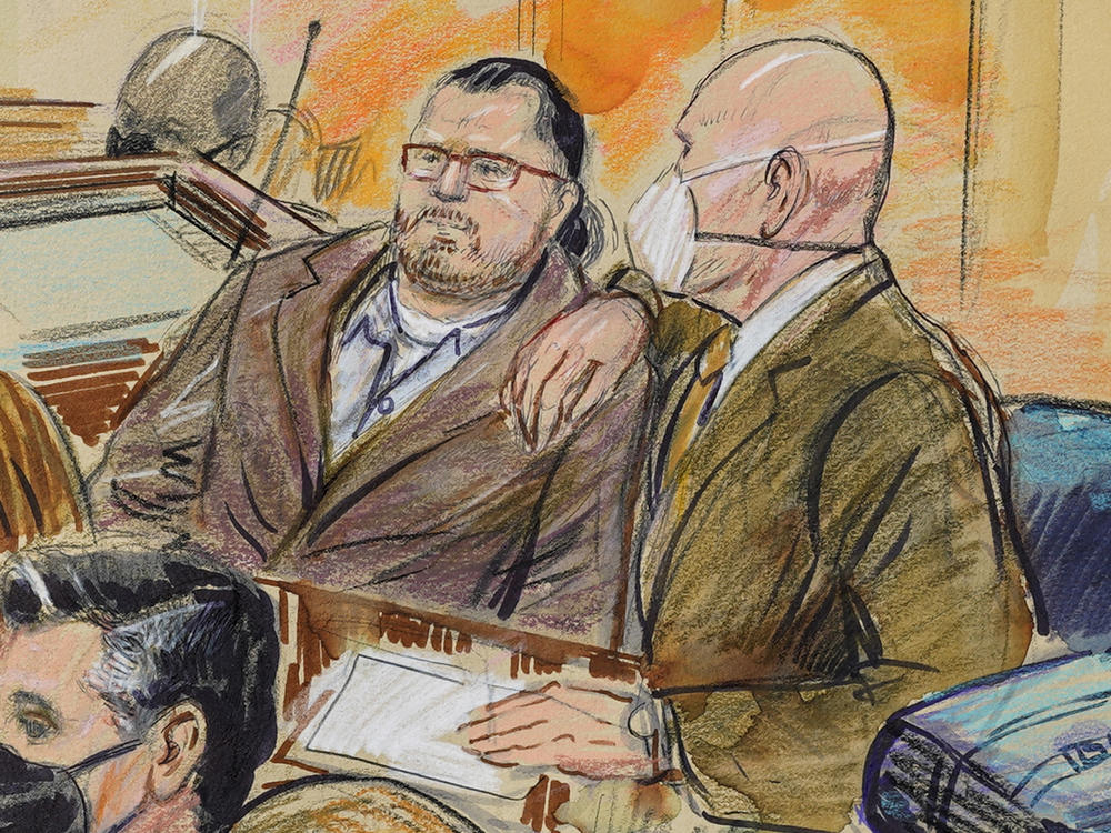 This sketch depicts Guy Wesley Reffitt (left) and his lawyer, William Welch, in federal court in Washington, D.C., on Feb. 28. A jury found Reffitt guilty on all counts for his participation in the Jan. 6, 2021, riot at the U.S. Capitol.