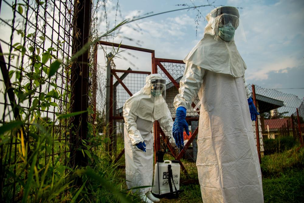 Medical staff are sterilized before entering the isolation unit at a hospital in Bundibugyo, western Uganda, on Aug. 17, 2018, where there is one suspected case of Ebola.  The hospital in Bundibugyo town is the main facility in the Bundibugyo district for treatment of potential cases.