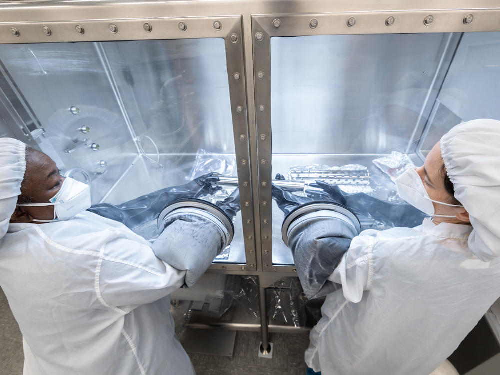 Scientists work on gas extraction from an Apollo 17 lunar sample last month at NASA's Johnson Space Center in Houston.