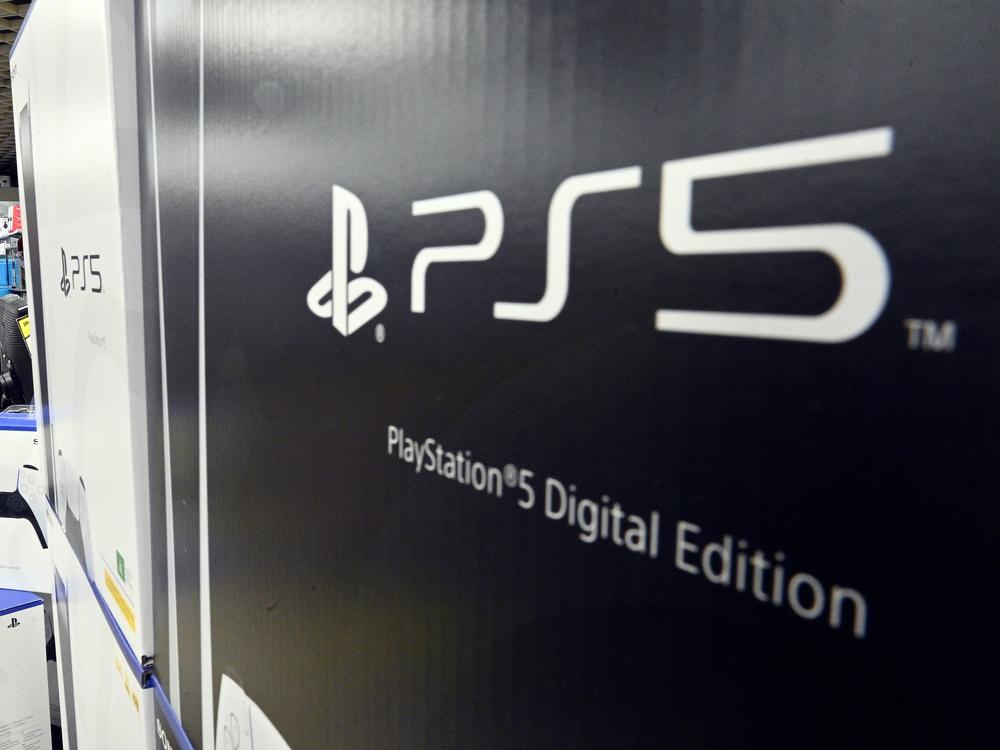 A customer waits in a queue inside an electronics store in Sydney on Nov. 12, 2020, on the day of the official launch of Sony's next-generation PlayStation 5 gaming console.