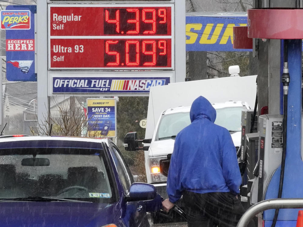 A man pumps gas at a Giant Eagle GetGo in Mount Lebanon, Pa., on Monday.