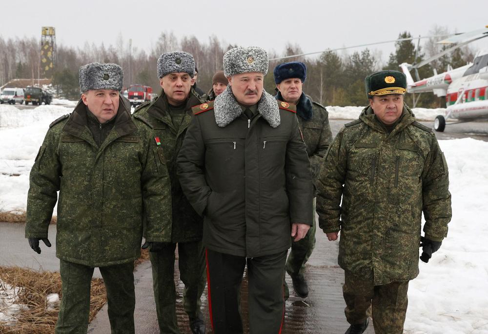 Belarus' President Alexander Lukashenko (center) attends his country's joint military exercises with Russia at a firing range outside Minsk on Feb. 17.