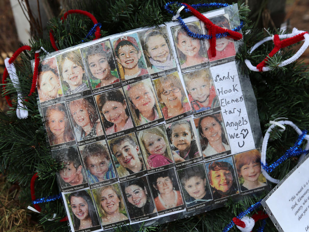 Photos of Sandy Hook Elementary School massacre victims sits at a small memorial near the school on Jan. 14, 2013 in Newtown, Conn.