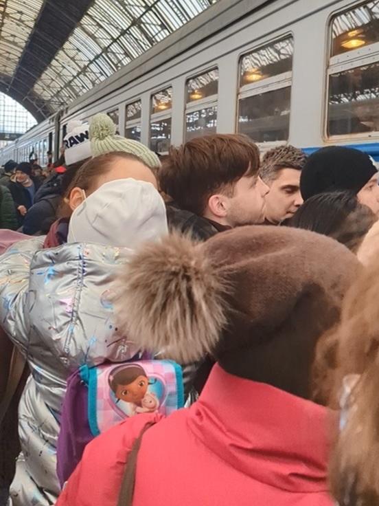 The crush Inna Grynova sees as the train arrives.