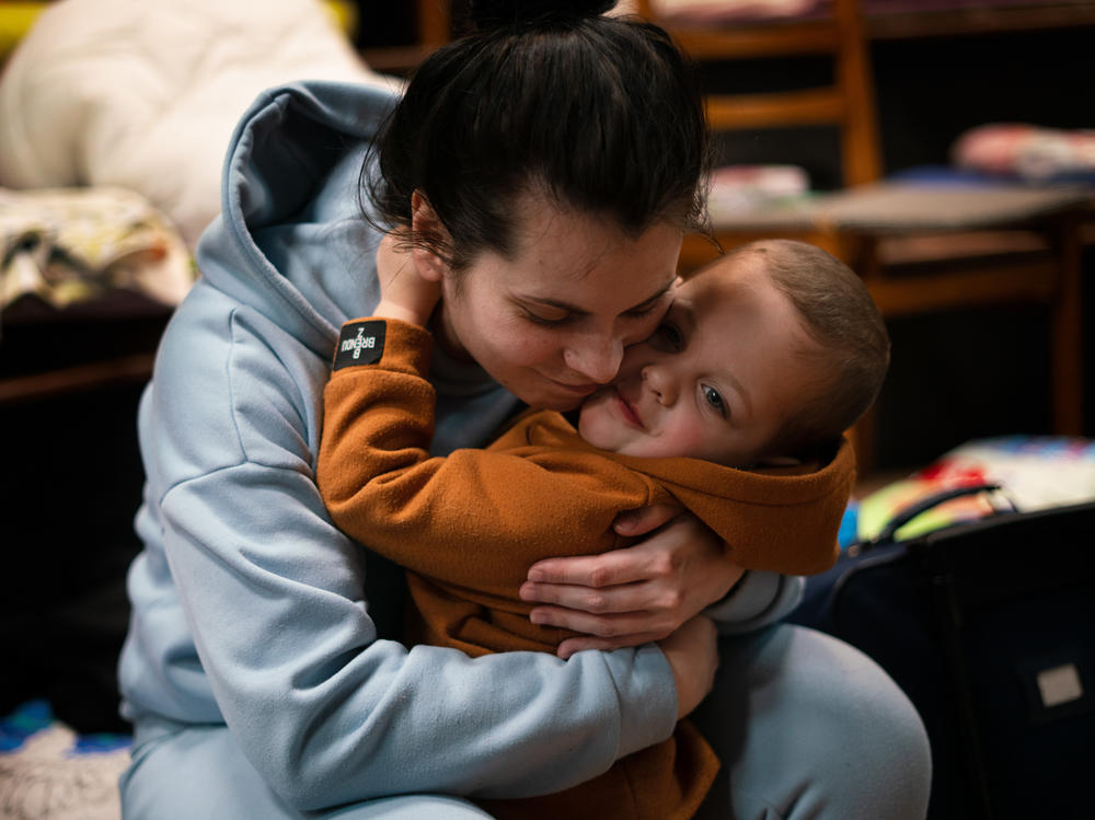 Nadia Kuzhukhar, 27, fled Kyiv with her sister and 2-year-old son, Maksim. They temporarily sheltered in the Church of St. Lazarus in Lviv, Ukraine.