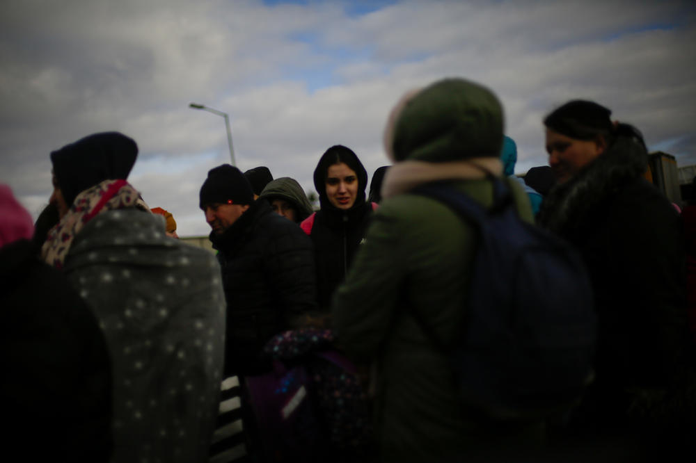 People queue for hours at the Ukrainian-Polish border at Korczowa-Krakovets.