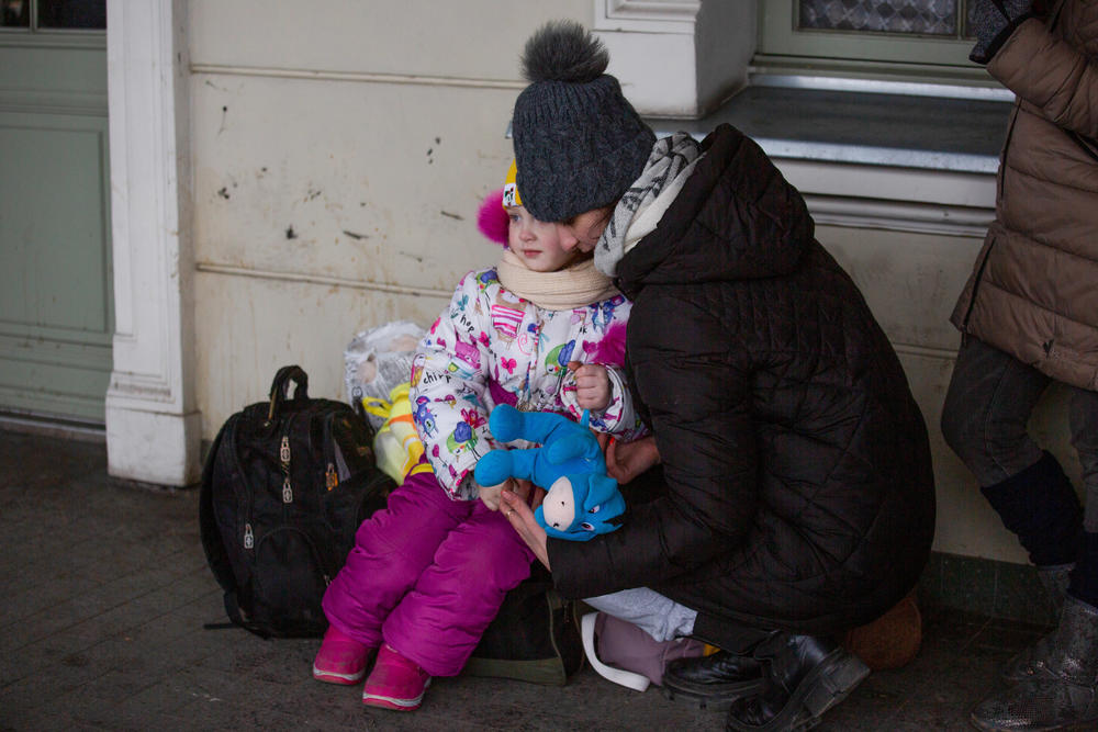 Stuffed animals are among the free items offered to refugees when they arrive at the train station.