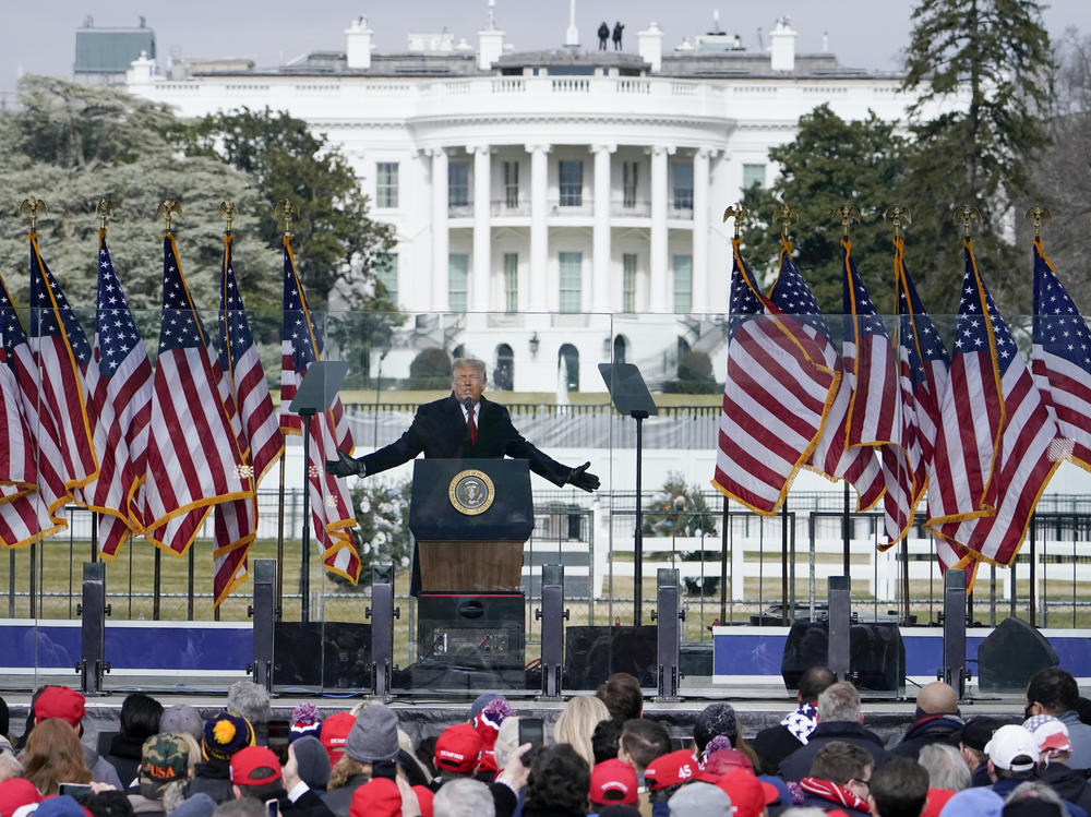 With the White House in the background, President Donald Trump speaks at a rally on Jan. 6, 2021. The House committee investigating the attack on the Capitol is probing the funding for the rally and other events that preceded the deadly insurrection.