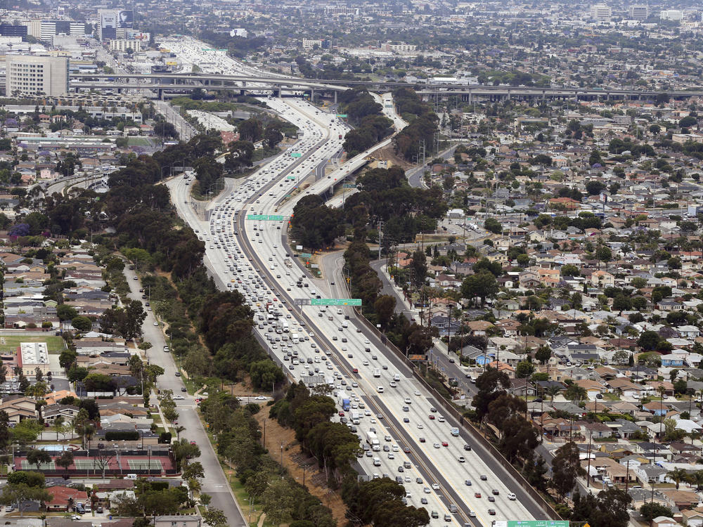 Interstate 405 cuts through neighborhoods near the Los Angeles International Airport, seen here in 2017. A new study found links between modern urban air pollution and historical redlining at the national level.