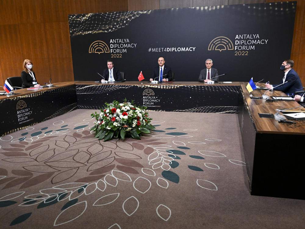 In this photo released by the Russian Foreign Ministry Press Service, Turkish Foreign Minister Mevlut Cavusoglu (center) chairs a tripartite meeting with Russia's Foreign Minister Sergey Lavrov (left) and Ukraine's Foreign Minister Dmytro Kuleba(right) in Antalya, Turkey, on Thursday.