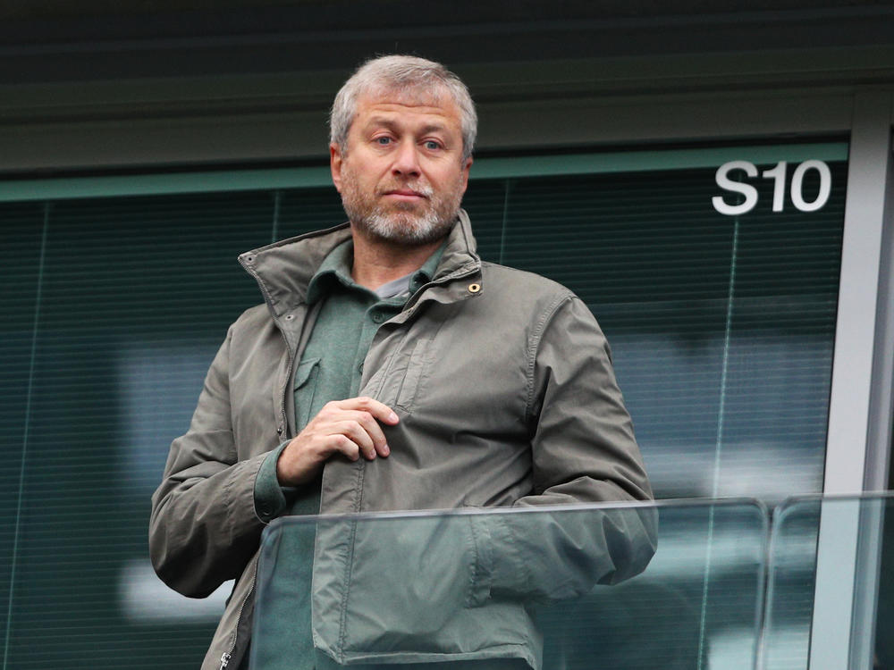 Roman Abramovich, pictured at a 2016 match in London, is facing an asset freeze and U.K. travel ban just a week after he announced plans to sell Chelsea Football Club.