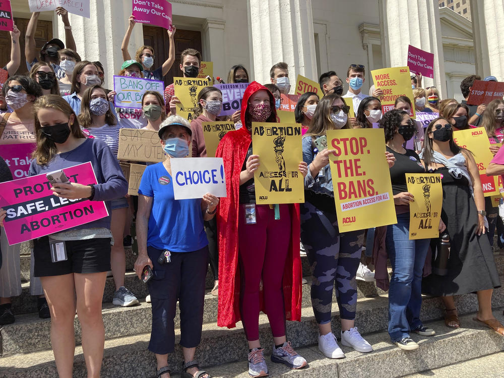 Legal experts say so-called bounty hunter bills, including the Missouri measure that would let people sue anyone they suspect of helping a resident get an abortion in another state, are most certainly unconstitutional, with little chance of withstanding legal challenges. Here, abortion-rights activists gathered to protest Republican-led restrictions in St. Louis last September.