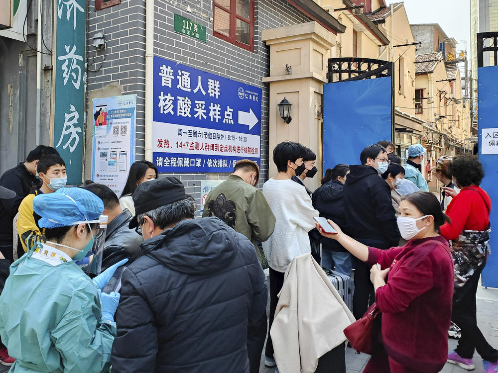 People line up for coronavirus tests outside a hospital in Shanghai on Friday.