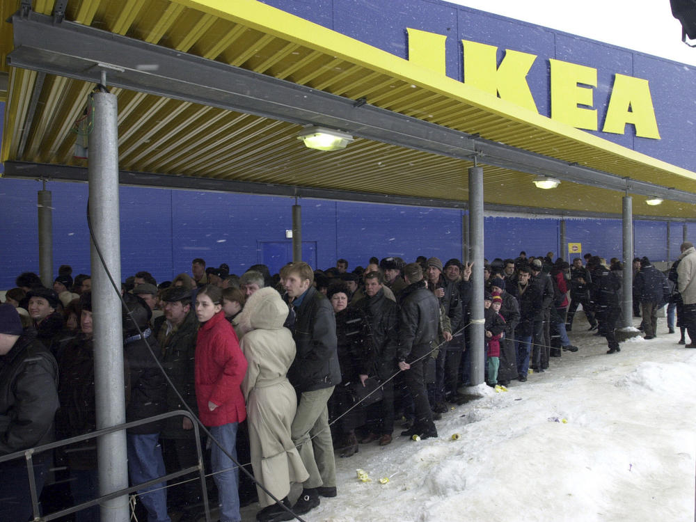 People line up to get inside the first IKEA store opened just outside Moscow, in this March 22, 2000 file photo.