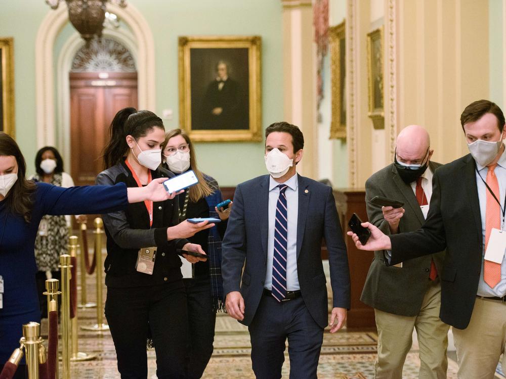 Democratic US Senator Brian Schatz speaks to reporters in the US Capitol in Washington, DC on February 13, 2021. Schatz is part of a group of lawmakers looking into the use of compassionate release waivers in federal plea deals.
