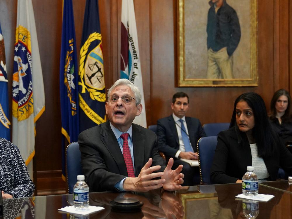 Flanked by US Deputy Attorney General Lisa Monaco (L) and Associate Attorney General Vanita Gupta, Attorney General Merrick Garland convenes a Justice Department component heads meeting at the Justice Department on March 10. Garland was prompted by an NPR story on compassionate release waivers to fix the issue.