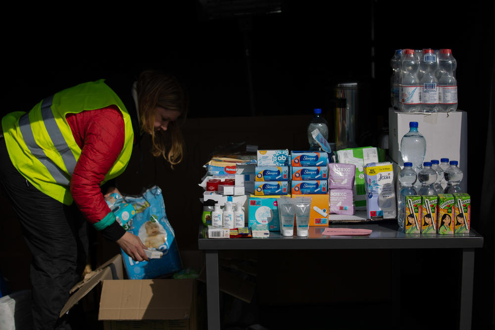 Toiletries and bottled water are among the free offerings for incoming refugees. The many aid organizations here also provide medical and veterinary care, warm food and clothing.