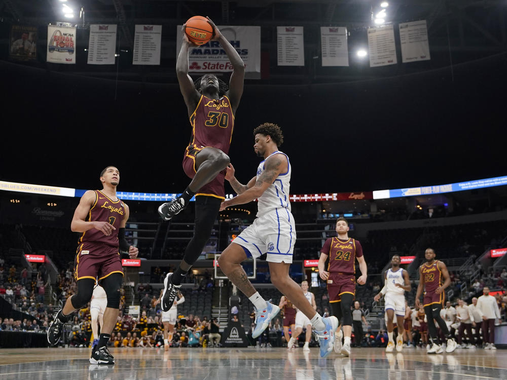 Loyola of Chicago's Aher Uguak (30) heads to the basket during the first half of an NCAA college basketball game against Drake in the championship of the Missouri Valley Conference tournament on March 6.