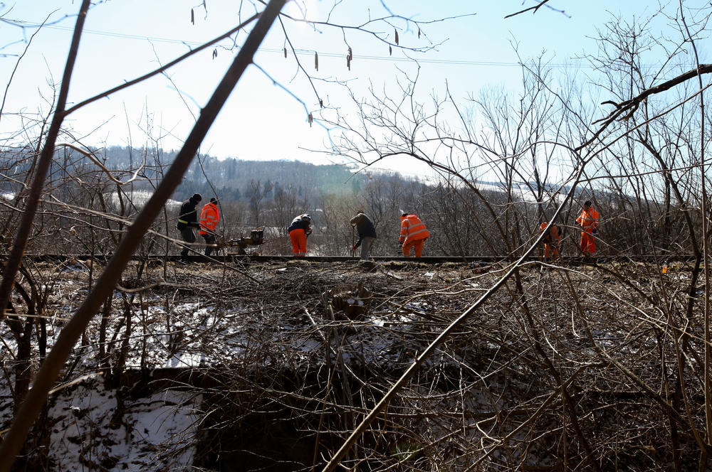 They are rushing to rebuilding an abandoned rail line first laid more than a century ago that runs through the Carpathian Mountains from Ukraine into Poland. They hope it will help ferry refugees escaping Russia's war on Ukraine to safety
