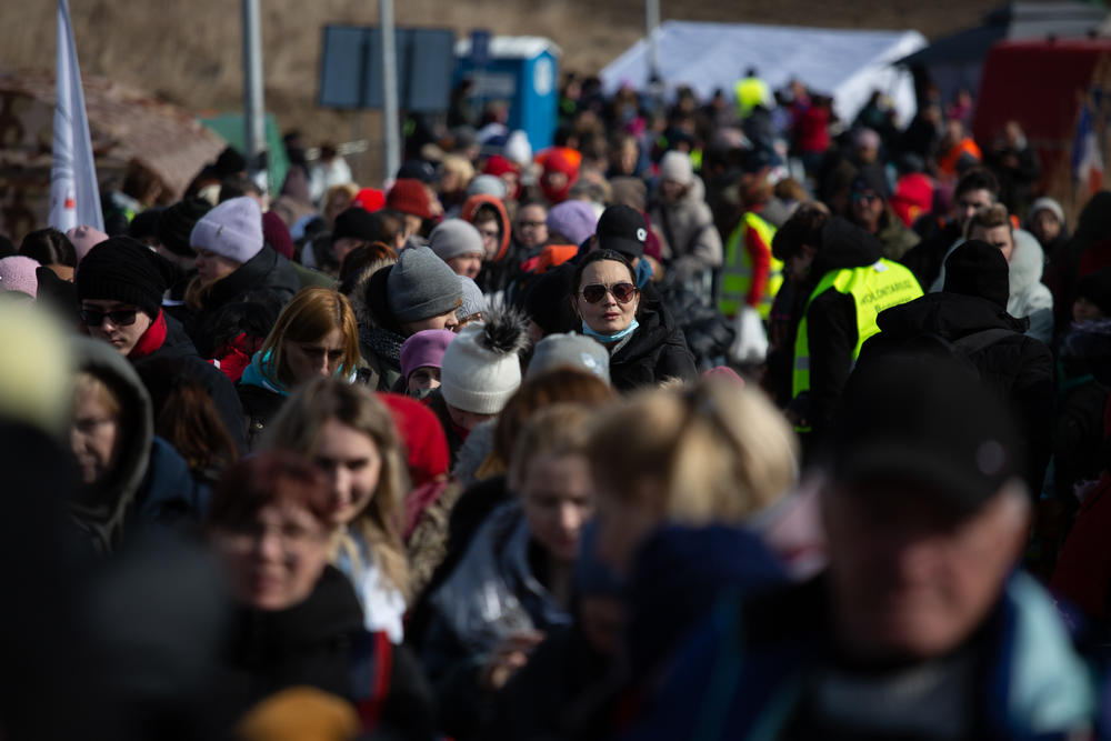 Waves of refugees from Ukraine arrive each day at the southern Polish city of Medyka. Among the crowd is Paulina Andrieva (center, wearing sunglasses) from Nikolaev, who traveled to the town with her two daughters and one son.