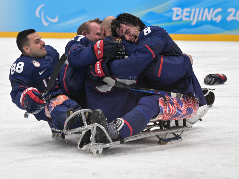 Team USA celebrates after winning the para ice hockey final match between the U.S. and Canada.