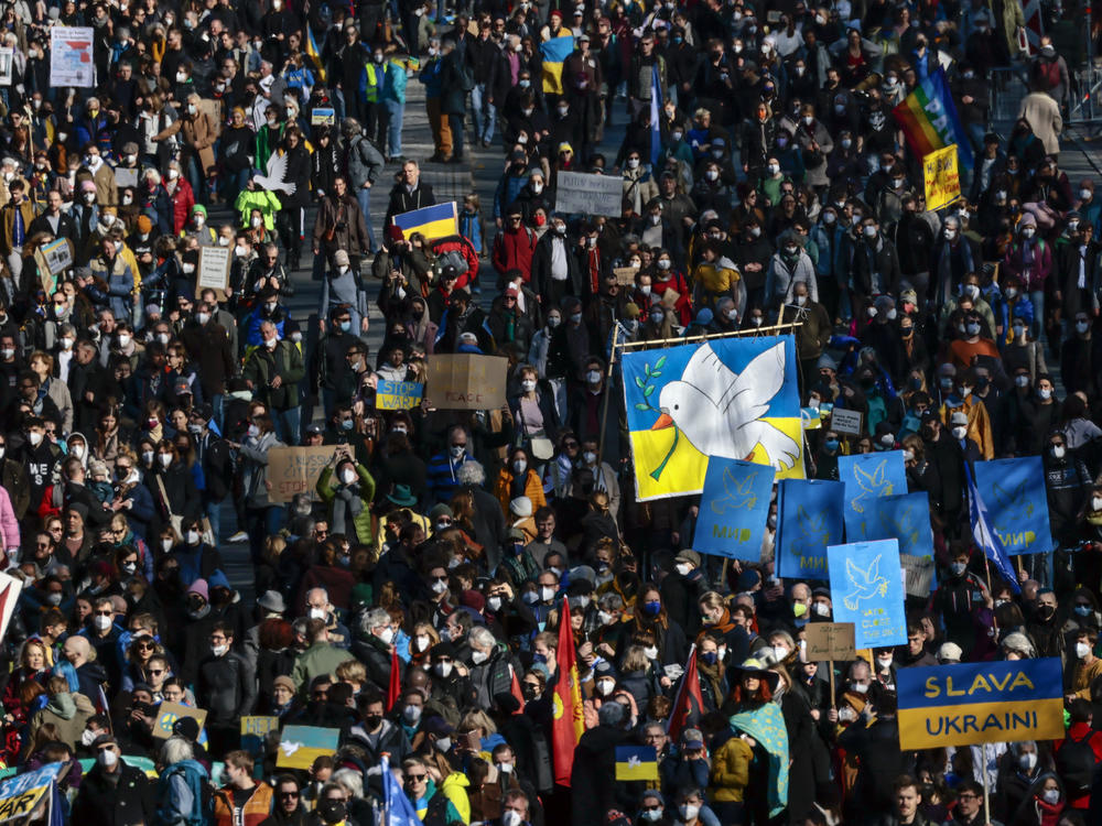 People protesting Russia's invasion of Ukraine gather in Berlin on Sunday.
