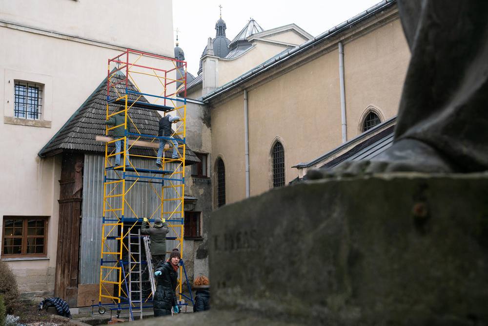 Scaffolding is set up so workers can cover a wooden altar at Lviv's centuries-old Armenian Cathedral.