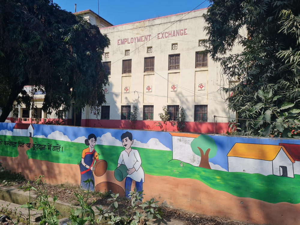The Employment Exchange building in the city of Prayagraj, home to government offices that address job-related issues. The mural in front of the building urges people to throw trash in garbage cans.