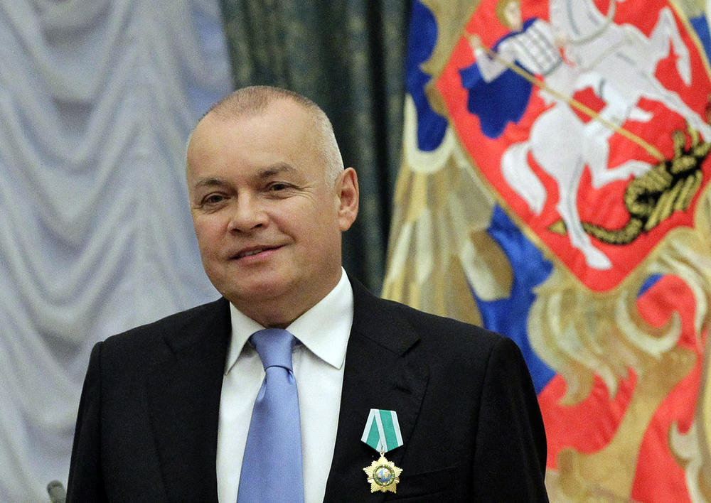 Russian TV host Dmitry Kiselyov, shown here receiving a medal of friendship at the Kremlin in 2011, led this week's broadcast of his show on Rossiya 1 by repeating Russian President Vladimir Putin's debunked claims of Ukrainian 