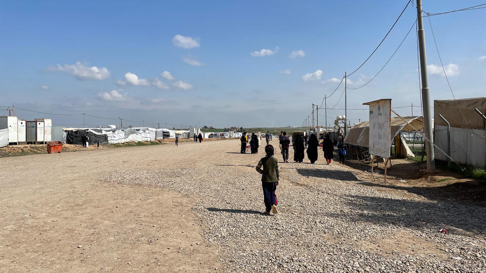 A child walks up the main street in the Hassan Sham displaced persons camp in northern Iraq.