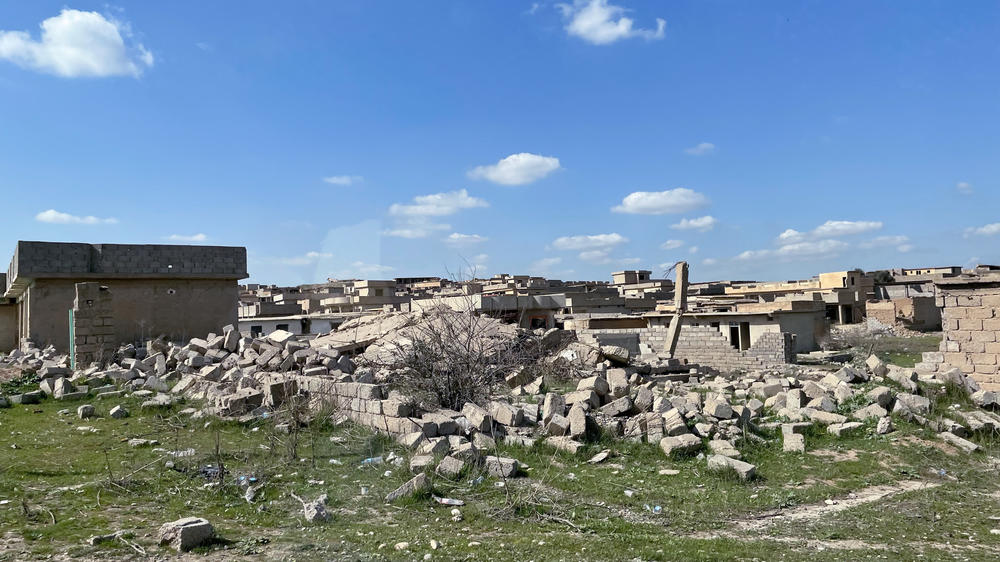 The remains of the village of Hassan Sham line the dirt road that leads to the Hassan Sham displaced persons camp. The village was an ISIS stronghold but was heavily damaged by Iraqi, Kurdish and U.S. forces in the war to drive the militant group out of Iraq.