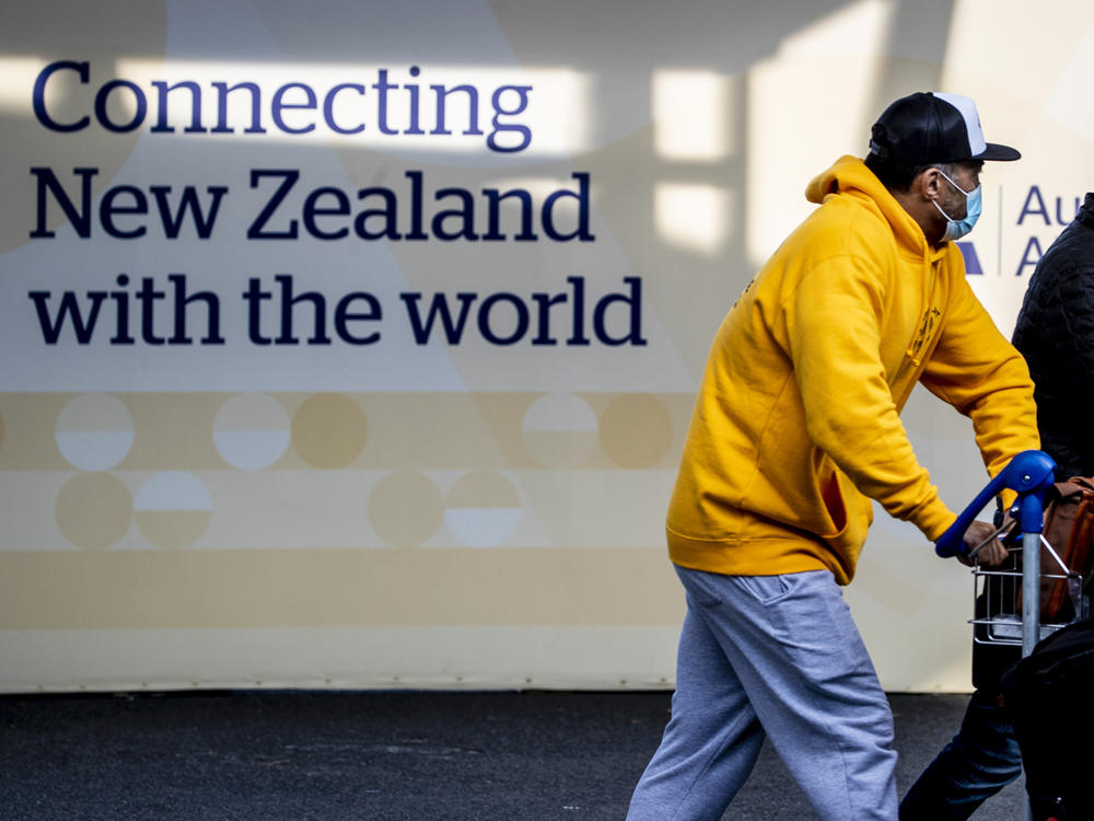 Passengers arrive at Auckland's International Airport, in Auckland, New Zealand, on Wednesday.