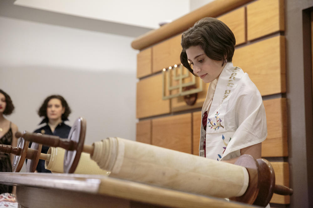 A young woman prepares to celebrate her bat mitzvah at The Village Temple in Manhattan on a recent Saturday morning.