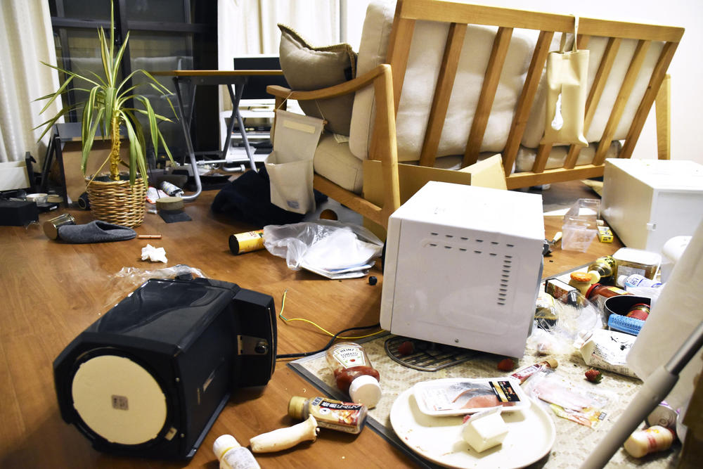 Furniture and electrical appliance are scattered at an apartment in Fukushima, northern Japan, on Wednesday.