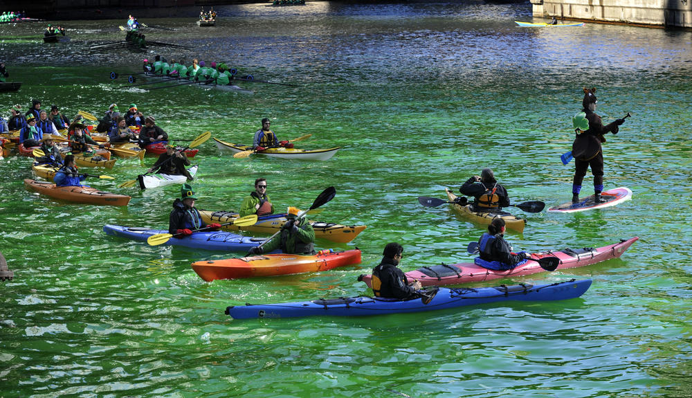 Kayakers float on the Chicago River after it was dyed green ahead of the St. Patrick's Day parade on March 15, 2014.