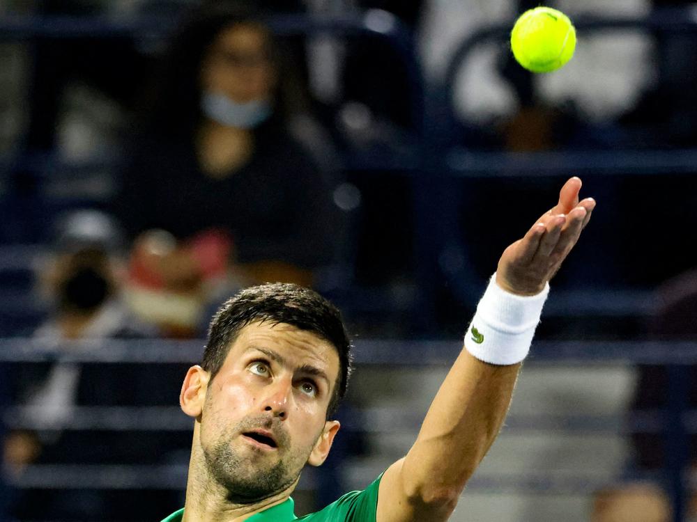 Novak Djokovic of Serbia plays against Russian Karen Khachanov, during the ATP Dubai Duty Free Tennis Championship on Feb. 23. Thanks to loosening COVID-19 restrictions in France, Djokovic is set to compete in May at the French Open.