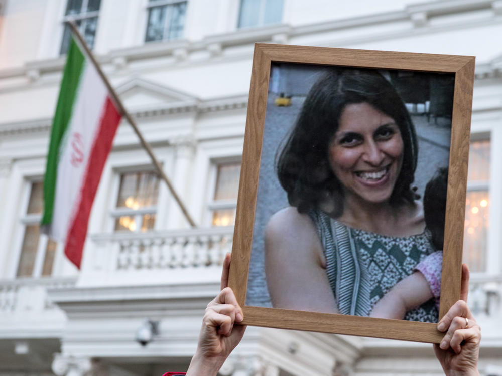Supporters hold a photo of Nazanin Zaghari-Ratcliffe during a vigil in London in 2017. Iran released Zaghari-Ratcliffe, who was imprisoned in 2016, and Anousheh Ashouri, a businessman, on Wednesday.