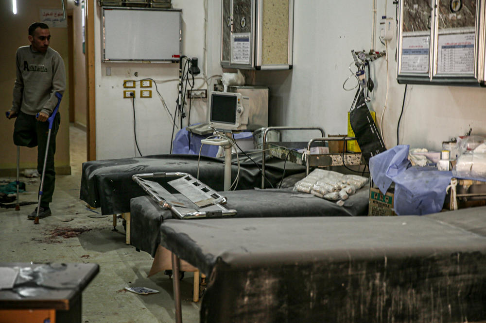 A man walks with crutch in a hospital in western Aleppo, Syria, damaged by attacks by the Bashar al-Assad regime during the country's ongoing civil war.