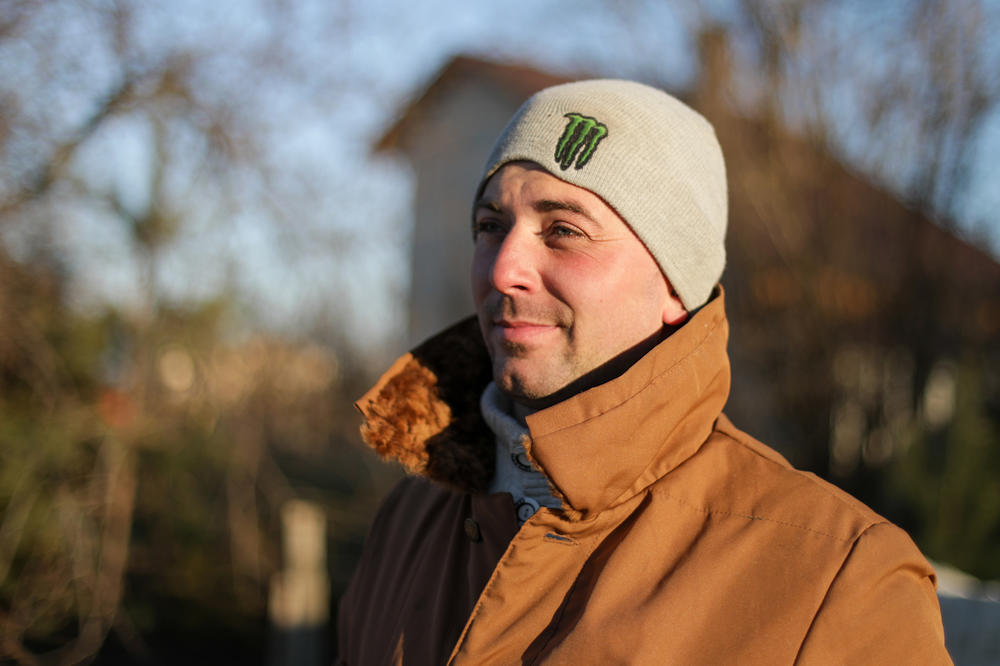 Bohdan Khrystina helps maintain a checkpoint on a road outside the city of Lviv in western Ukraine, hundreds of miles from the battles raging to the east.